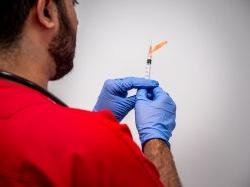 Close up photograph of male nursing student in the simulation lab.