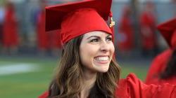 Master's candidate in red cap and gown